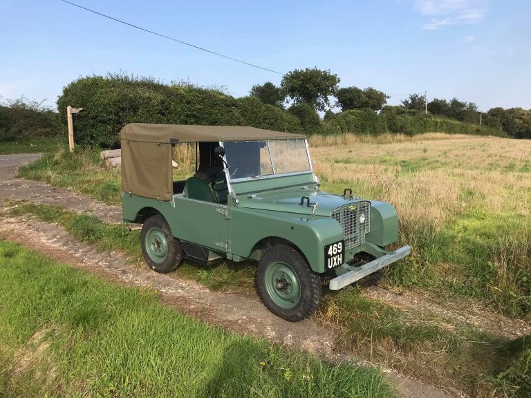 1949 early land rover in field