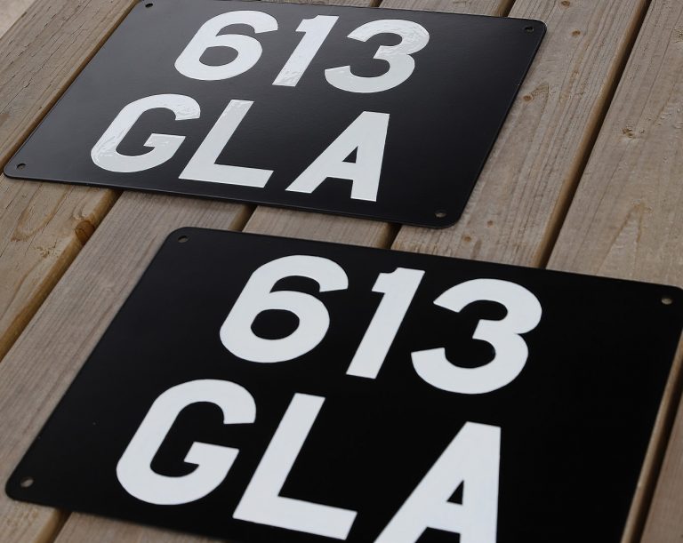 Signwritten number-plates ready for posting