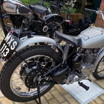 Wonderful restored 1951 Triumph Trophy motorcycle rear view showing hand painted number plate