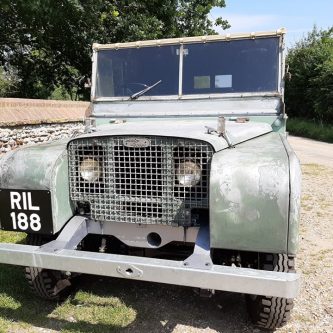 Early Land-Rover with plenty of patina and hand painted plates
