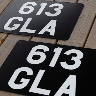 Signwritten number-plates ready for posting