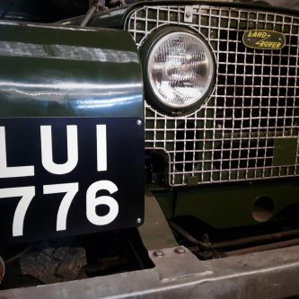 From sign writing videos LUI 776 hand painted number plate fitted at the front of an early Land-Rover