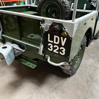 Hand painted show plate on Land-Rover Series One