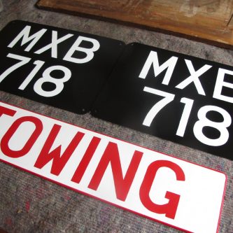Signwritten number-plates and Towing sign